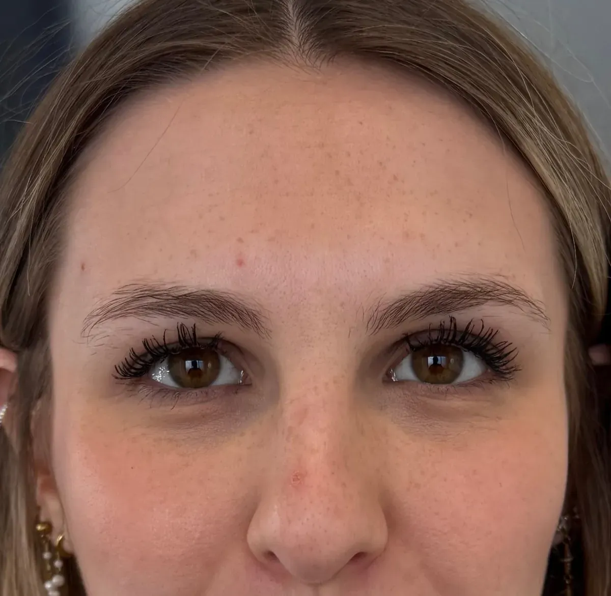 Dark blonde client before powder brows