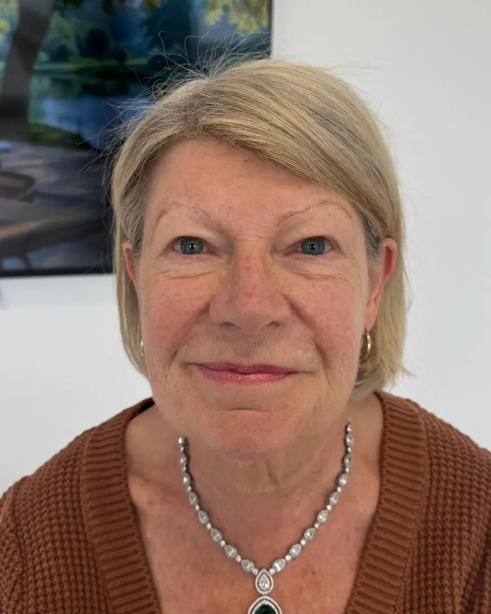 Mature client with gray-white hair before powder brows