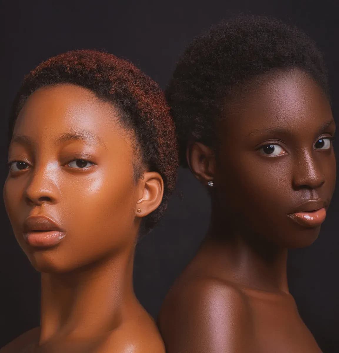 On the left, golden dark skin; on the right, cooler dark skin