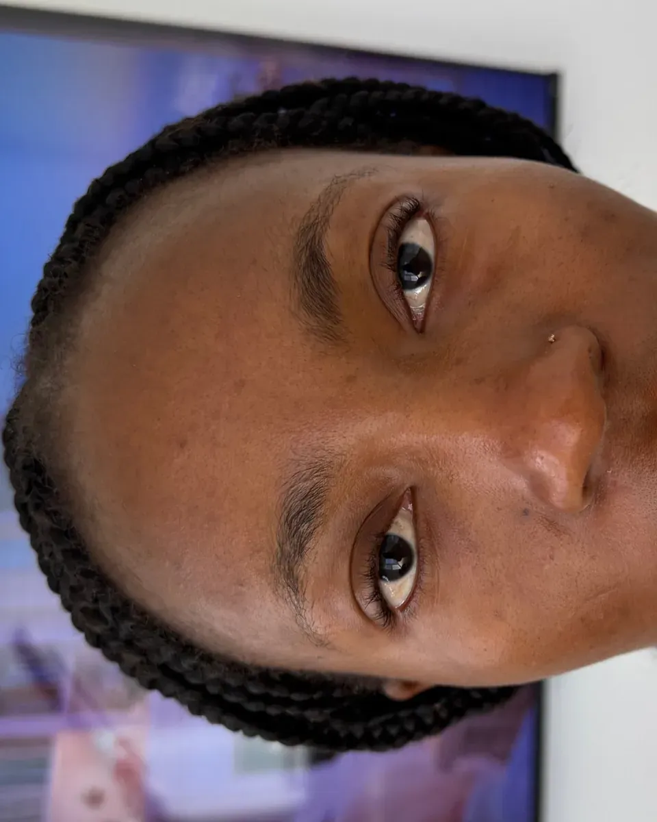 Dark skin with sparse brows, before powder brows