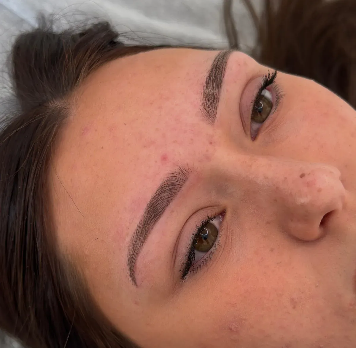 Brown-haired client, healed powder brows 18 months later
