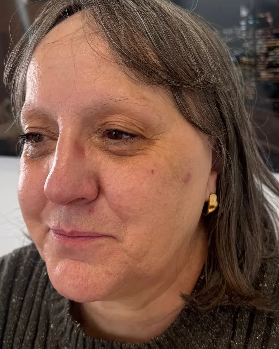 Mature client with gray hair and almost nonexistent brows, before