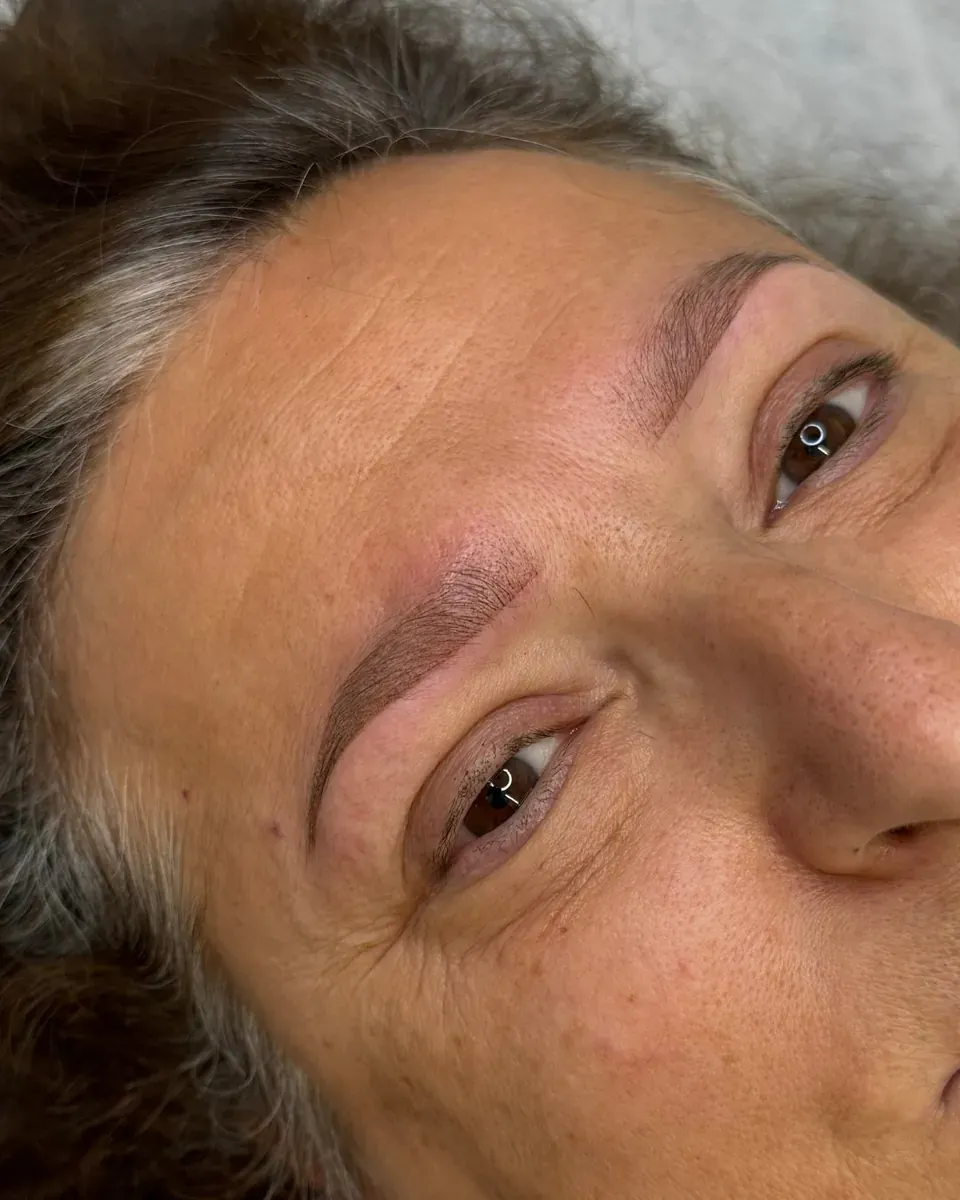 Client with mature, combination-to-oily skin, right after powder brows